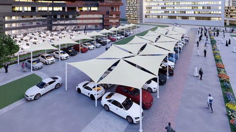 Aerial view of a long run of white car parking shades beside a walkway